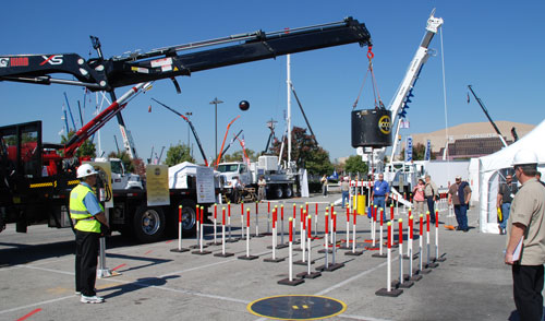 Articulating crane operator navigates the CCO practical exam test course at ICUEE 2011.